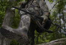 photo of the best hunting boots under $150 stepping over a log