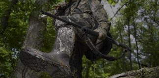 photo of the best hunting boots under $150 stepping over a log